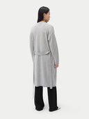 Person wearing a long gray cardigan on a plain background #color_dawn-blue