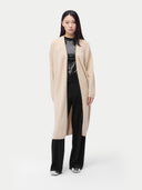 front view of a beige long cardigan over a black outfit on a white background #color_beige
