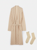 Beige robe and socks set on a white background #color_beige