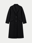 A black mid-length coat with a notched lapel, three-button front closure, and flap pockets, shown on a light gray background.