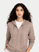 Woman wearing a brown zip-up hoodie on a white background #color_taupe