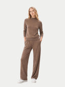 front view of a woman wearing a brown outfit on a white background #color_taupe