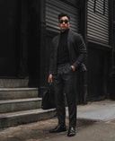 Man in charcoal cashmere turtle neck and tailored trousers on city street — @GobiCashmere