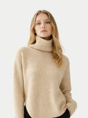 Woman wearing a beige turtleneck sweater on a white background #color_beige