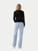 back view of a black hoodie and light blue jeans on a white background. #color_black