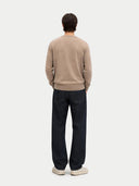 back view of a beige sweater and black pants on a white background #color_taupe