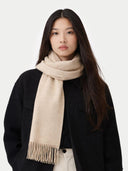Woman wearing a beige scarf on a white background #color_warm-grey