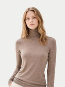 Woman wearing a brown turtleneck sweater on a light gray background #color_taupe