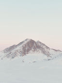 Snowy mountain peak with a clear sky. mobile