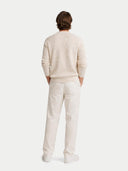 back view of a beige sweater and pants on a white background #color_off-white