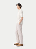 side view of a white shirt and light gray pants on a white background #color_whisper-white