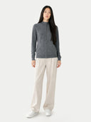 front view of a woman wearing a gray zip-up sweater and beige pants on a white background #color_plum-kitten