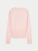 back view of a light pink sweater on a white background #color_peach-blush