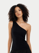 Woman wearing a black one-shoulder top against a plain background #color_black