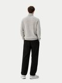 back view of a person wearing a gray sweater and black pants on a white background #color_dawn-blue
