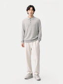 front view of Person wearing a gray long-sleeve shirt and white pants on a white background #color_vapor-blue