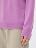 Purple sweater worn by a person on a white background #color_fuchisa-pink