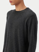 close up of a dark gray crew neck sweater  worn by a man on a white background #color_charcoal