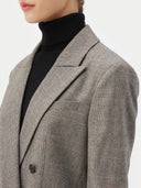 a zoomed-in shot of a gray blazer #color_warm-grey