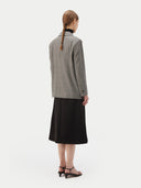 back view of a gray blazer and black skirt #color_warm-grey