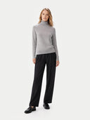 front view of a woman wearing a gray turtleneck sweater and black pants on a white background  #color_high-rise