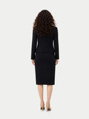Back view of a person wearing a black suit on a white background #color_black
