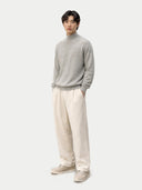 front view of Person wearing a gray sweater and beige pants on a white background #color_dawn-blue