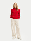 front view of a red jacket and white pants on a white background #color_racing-red