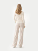 back view of a beige sweater and pants on a white background  #color_off-white