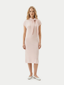 Woman wearing blush pink cashmere midi dress with bow-tie neckline — GOBI Cashmere Dresses