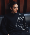 Man wearing black cashmere sweater with artistic horse print — GOBI Men Spring–Summer 2026
