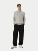front view of a man wearing a gray sweater and black pants on a white background #color_dawn-blue