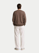 back view of a brown sweater and white pants on a plain background  #color_cocoa