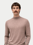 Man wearing a beige turtleneck sweater against a white background #color_timber-wolf