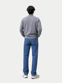 back view of person wearing a gray sweater and blue jeans on a white background #color_dim-gray