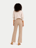 back view of a beige sweater and ribbed pants on a white background #color_warm-grey