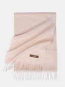 Beige scarf with a brand label on a white background #color_beige