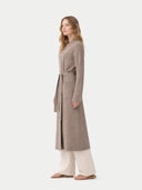 side view of a woman wearing a long brown bathrobe on a white background #color_taupe