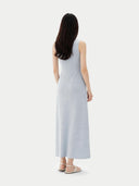back view of a woman wearing a light gray sleeveless dress on a white background #color_ice-flow