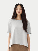 Woman wearing a plain gray t-shirt against a white background #color_wind-chime