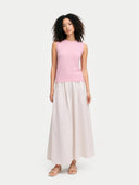 front view of a pink sleeveless top and white skirt on a white background #color_almond-blossom