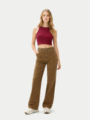 front view of Woman wearing a burgundy top and brown pants on a white background #color_dry-rose
