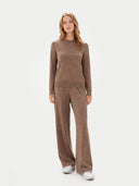 front view of a woman wearing a brown sweater and pants set on a white background #color_taupe