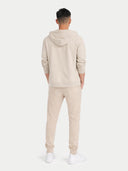back view of a beige hoodie and pants set on a white background #color_beige