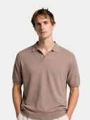 Man wearing a brown polo shirt against a white background #color_nomad
