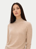 Woman wearing a beige turtleneck sweater on a white background#color_beige
