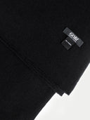 close up of a black scarf with a small label "GOBI" #color_black