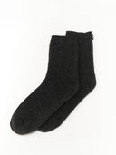 Pair of dark gray socks with a dark small label "GOBI" on a light gray background #color_charcoal