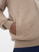 close up of a brown cardigan with hand on the side pocket #color_taupe