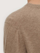 close up of a beige sweater shoulder #color_taupe